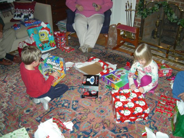 Stephanie is opening one while Cameron looks at Blokus