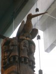 bird at the top of a story pole