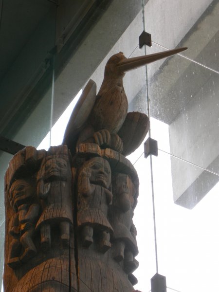 bird at the top of a story pole