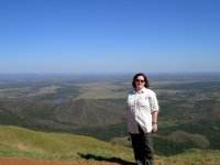 Cynthia and the plains view from the top of the mountain