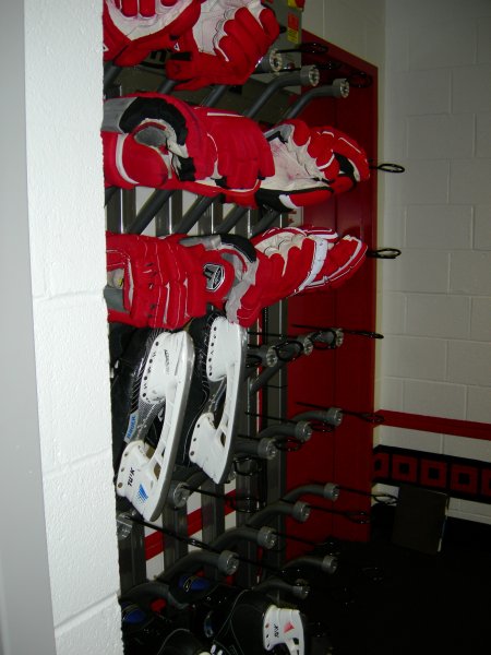 Gloves and skate warmers near the entrance to the bench.