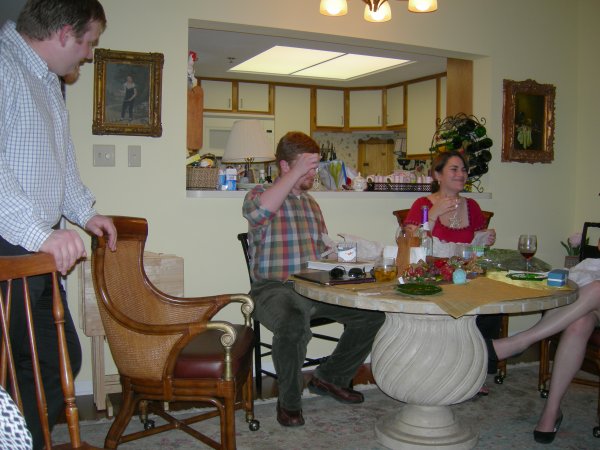 Jamie in the foreground, David and Angie, holding up the ornaments Cynthia and I gave them