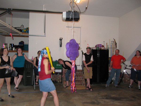 Ashton swinging at the piñata