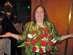 Cynthia wearing flowers around her neck