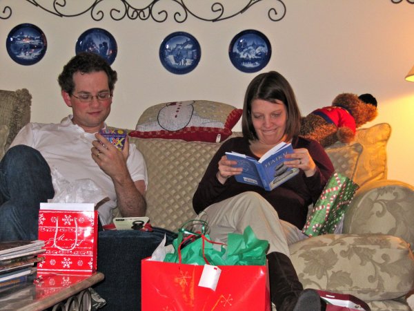 Jon and Anna looking at their presents