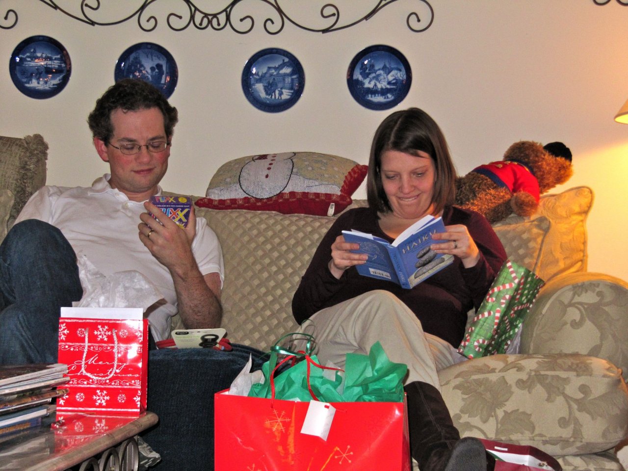 Jon and Anna looking at their presents