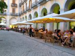 a small square filled with restaurants