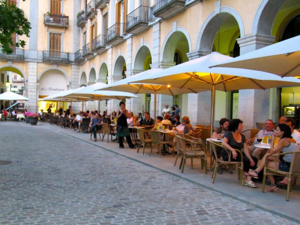 a small square filled with restaurants