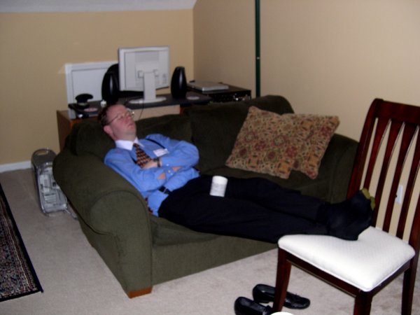 Lumberg is crashed on the couch after working all weekend