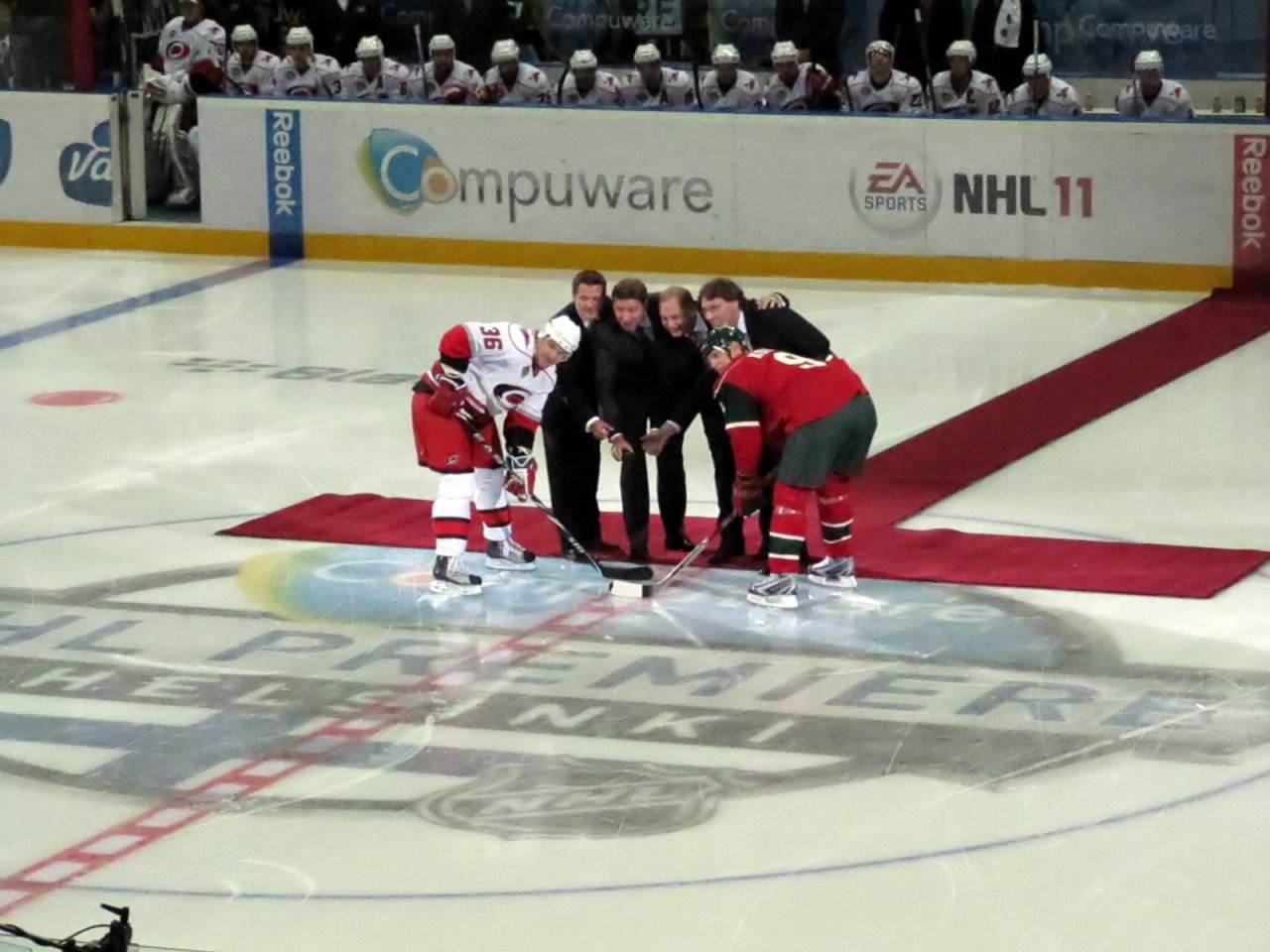 the requisite puck drop ceremony: Jussi Jokinen and Mikko Koivu with Sami Kapanen, Jari Kurri, Esa Tikkanen, and Jyrki Lumme