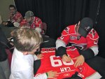 LaRose signing Cameron's jersey