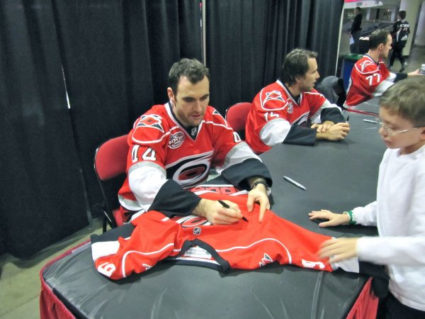 Jay Harrison signing Cameron's jersey