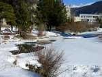 a partially un-frozen river passes through the resort