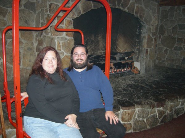 Cynthia and Ben posing in the "ski lift" at the fondue restaurant